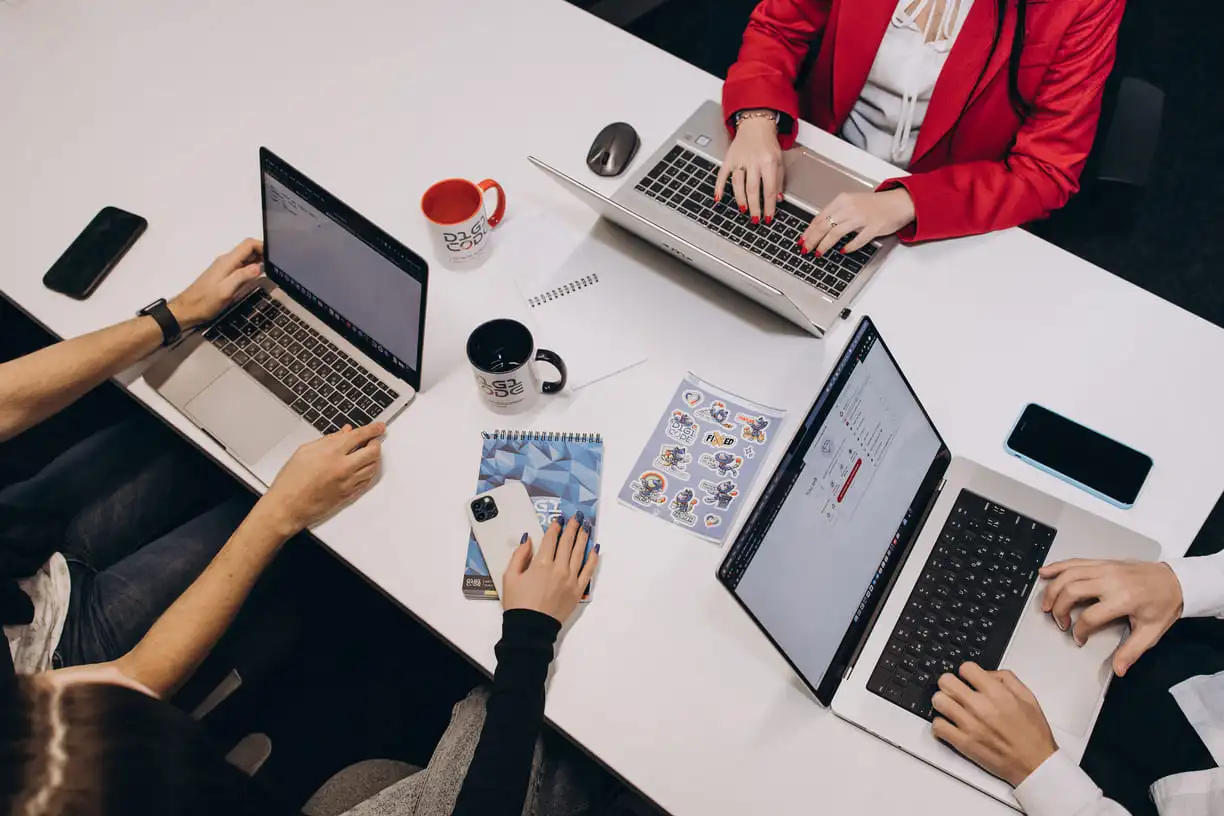 three laptops during work process