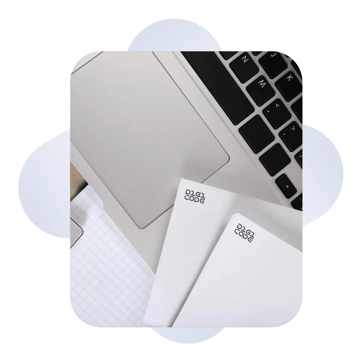 composition of a laptop, papers and blue shapes