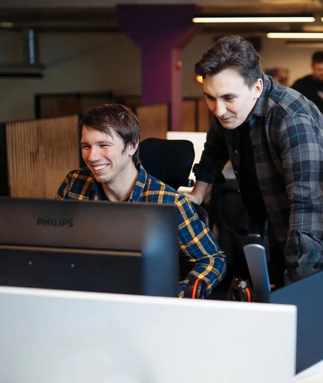 two developers in front of monitor