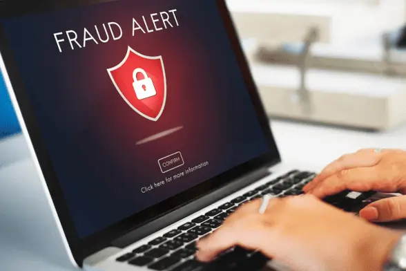 payment_page_grid3 fraud alert with red shieal and lock on laptop screen