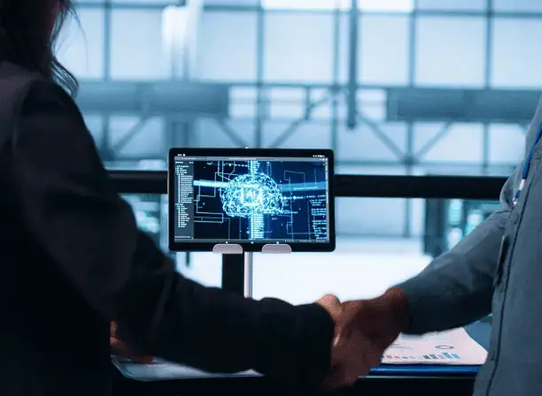 handshake in front of monitor